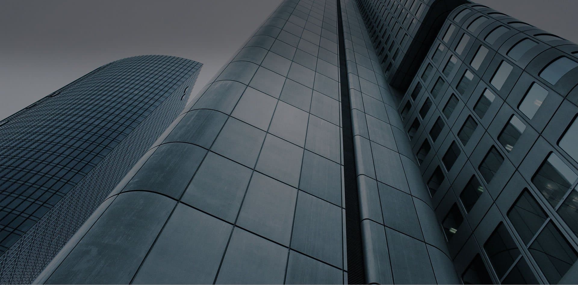 Corporate high-rise skyscrapers representing strength, growth, and advisory services